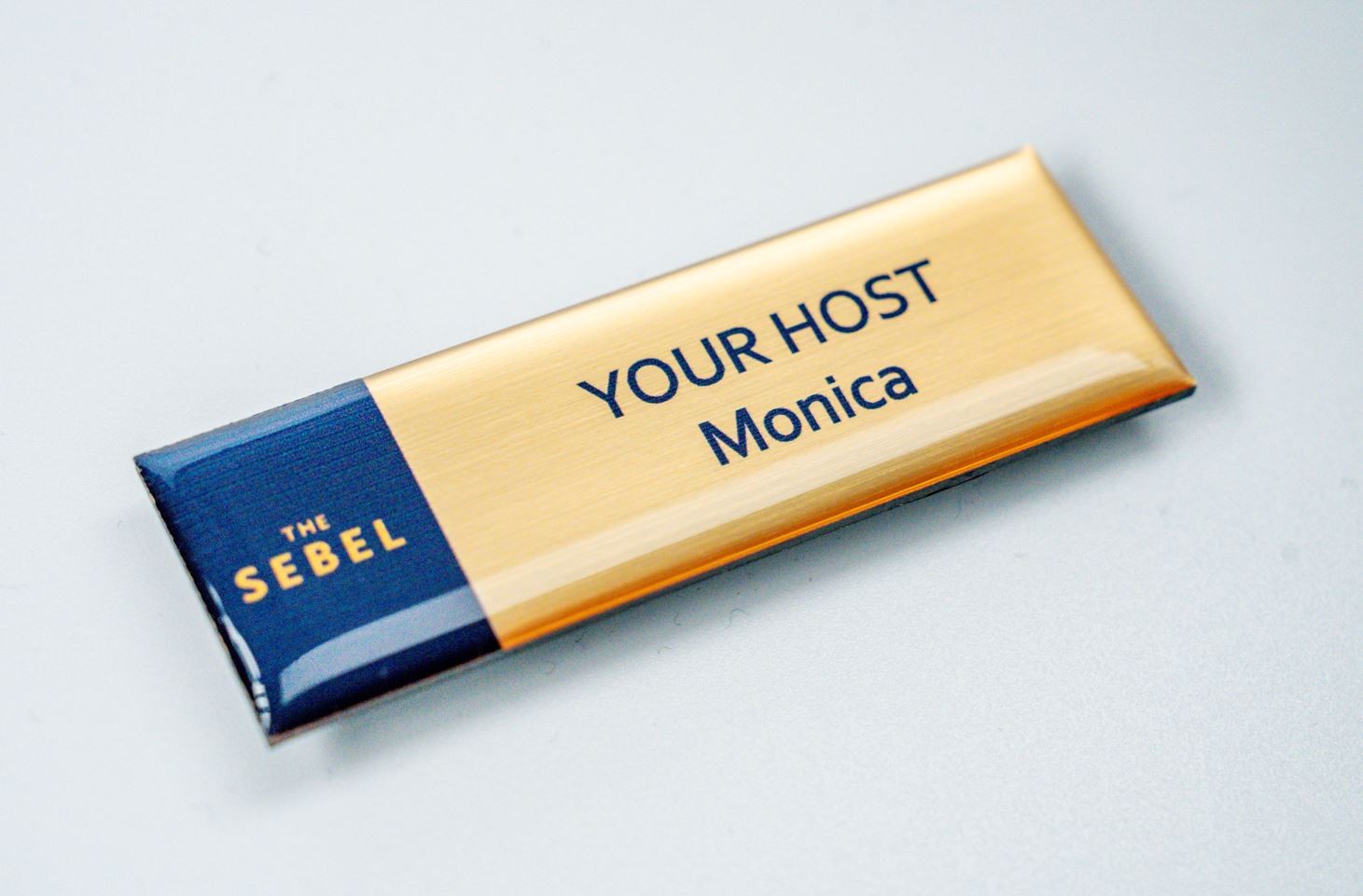 Gold Acrylic name badge with resin coating